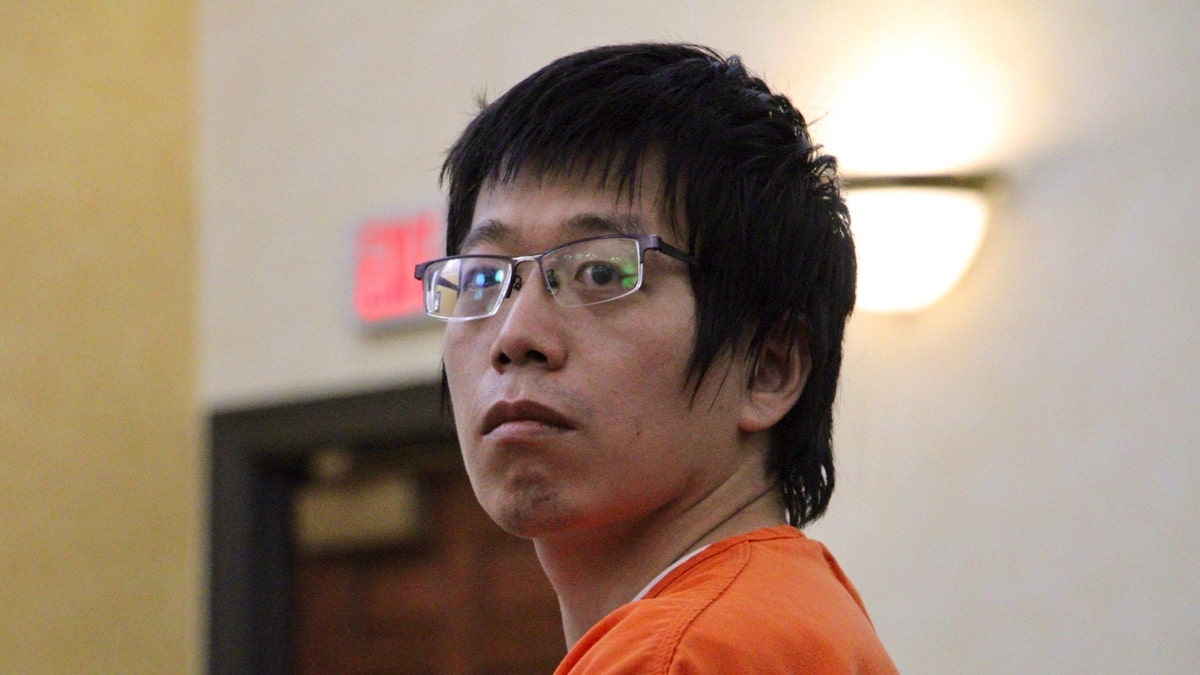 Tailei Qi, the graduate student suspected in the fatal shooting of a University of North Carolina at Chapel Hill faculty member, makes his first appearance at the Orange County Courthouse in Hillsborough, N.C., Tuesday, Aug. 29, 2023.