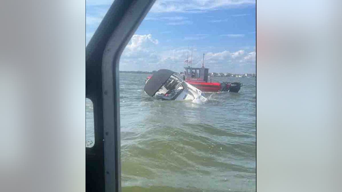 coast guard helping sinking vessel