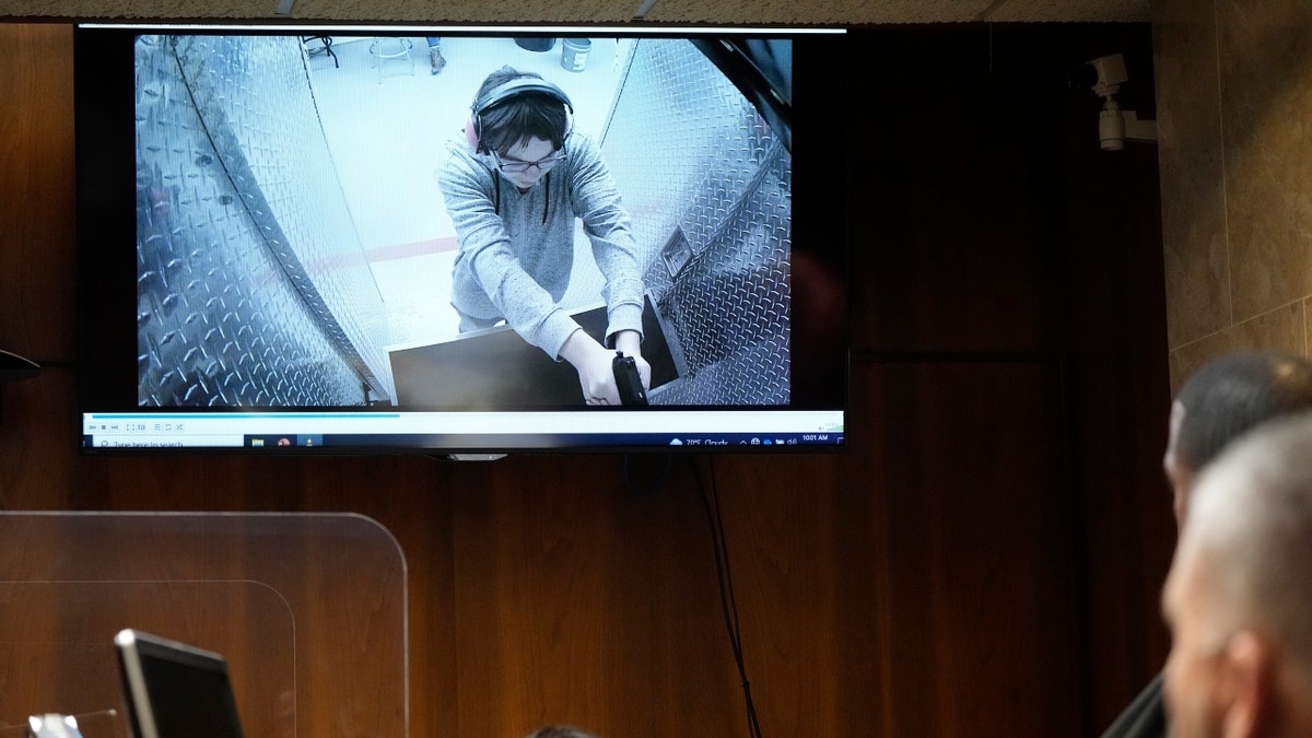 Ethan Crumbley is shown at a shooting range in a video displayed in court, Thursday, July 27, 2023, in Pontiac, Mich.