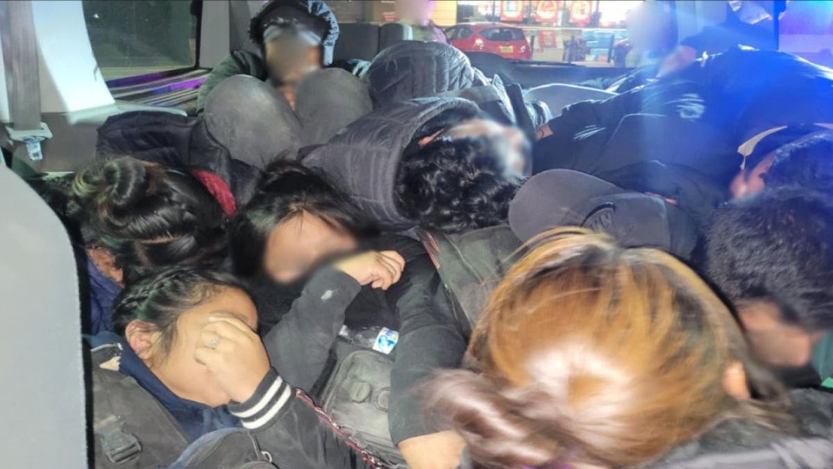 Illegal migrants packed into the back of a vehicle
