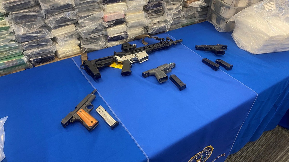 An evidence photo showing confiscated guns during the investigation