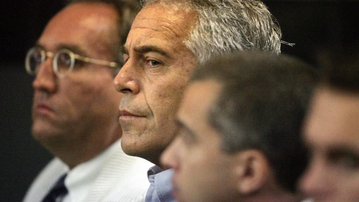 This July 30, 2008 photo shows Jeffrey Epstein in custody in West Palm Beach, Fla. Epstein was suspected nearly a decade ago of paying for sex with underage girls. The FBI abruptly dropped its investigation a few years ago, and Epstein pleaded guilty to a single state charge of soliciting prostitution. He served 13 months in jail. Now, two women who say they were sexually abused as girls by Epstein are hoping a trove of new documents will get the case reopened. (AP Photo/Palm Beach Post, Uma Sanghvi)