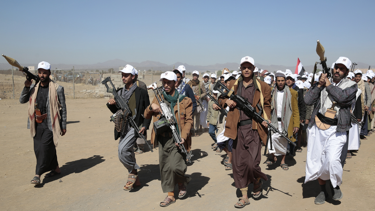 Houthi fighters rally against US government