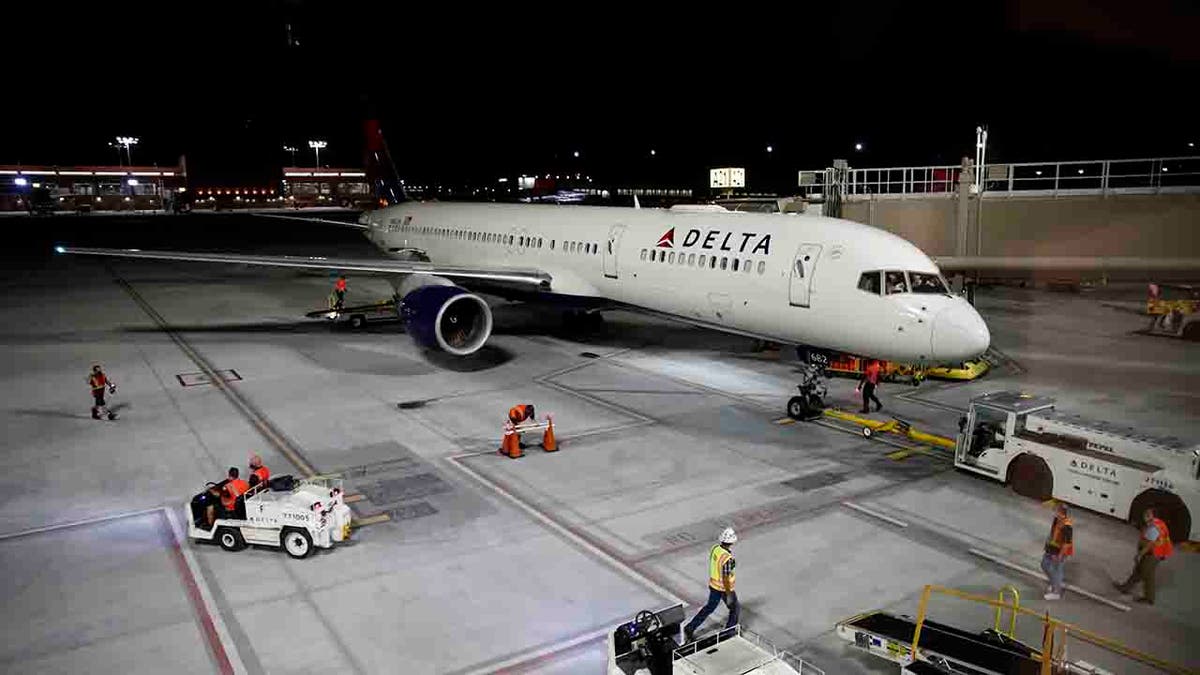 Delta Air Lines plane leaving gate