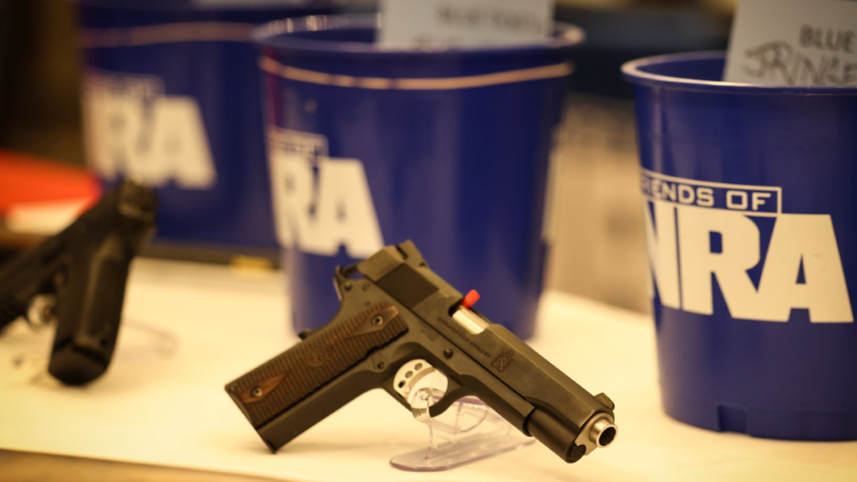 firearm sitting on table at NRA affiliated event