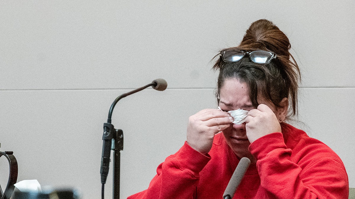 Kayla Montgomery, the estranged wife of Adam Montgomery, becomes emotional while being cross examined by Defense Attorney Caroline Smith during Adam Montgomery’s murder trial