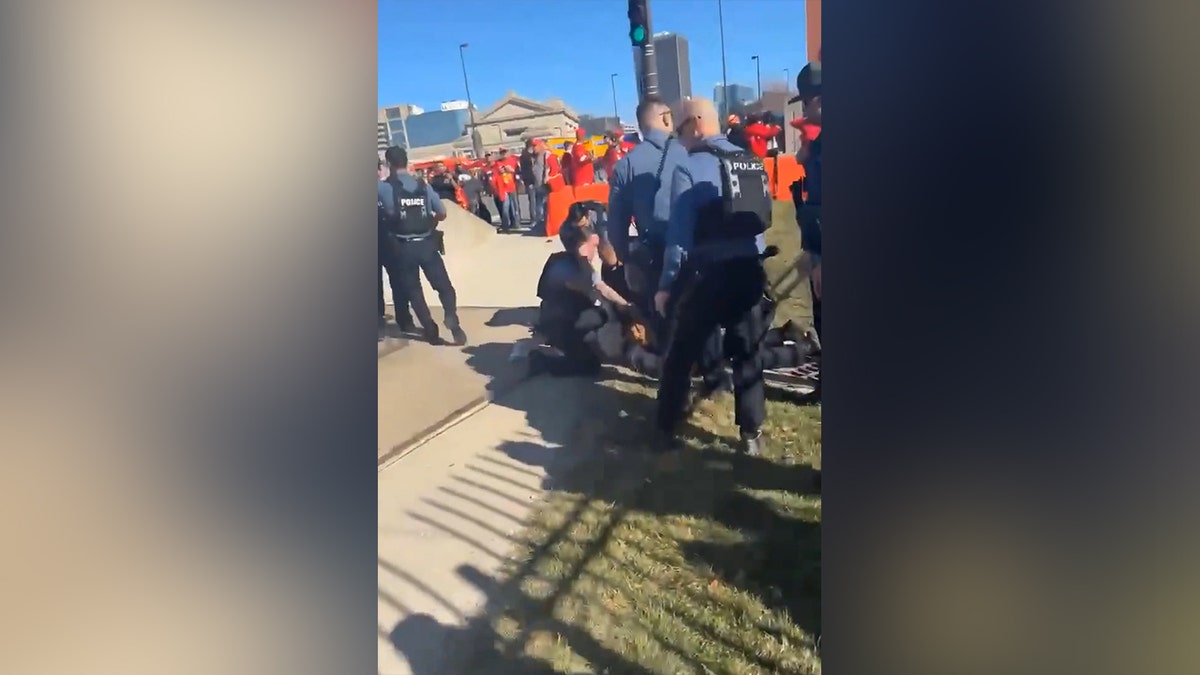 Kansas City Police taking down a man following a shooting at the Super Bowl parade