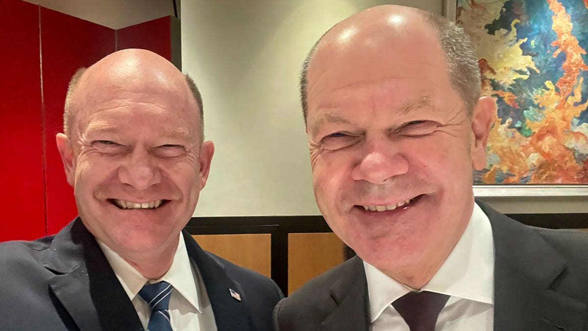 U.S. Sen. Chris Coons, left, and German Chancellor Olaf Scholz selfie