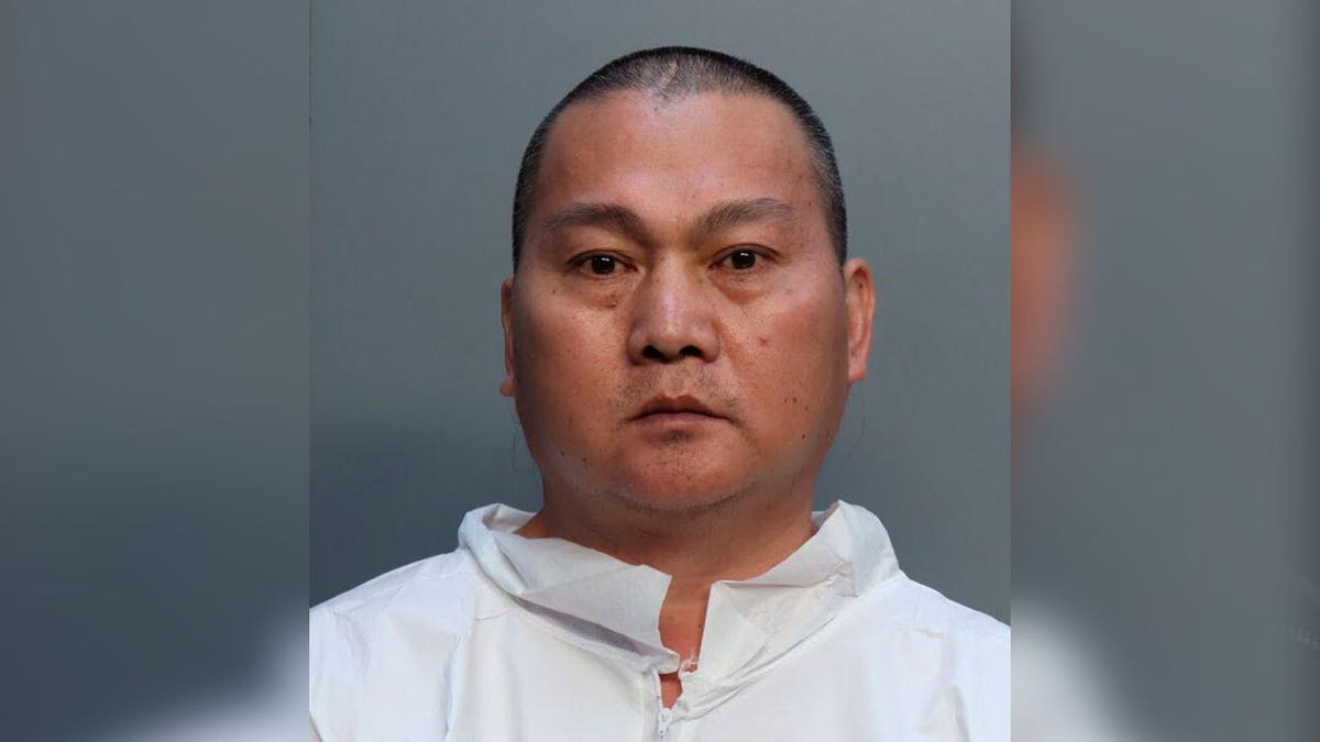 Chen Wu see wearing white jumpsuit in mugshot after Miami arrest