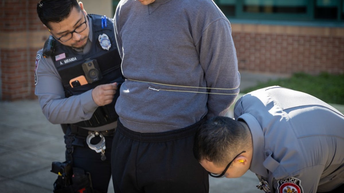 Fairfax County police in Virginia show how the hand-held restraint device called 