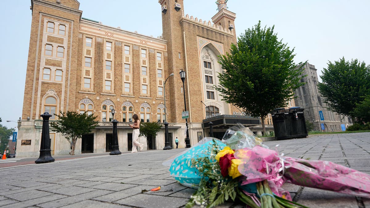 Flowers sit in front of the Altria Theater, the site of a mass shooting after a graduation ceremony in Richmond