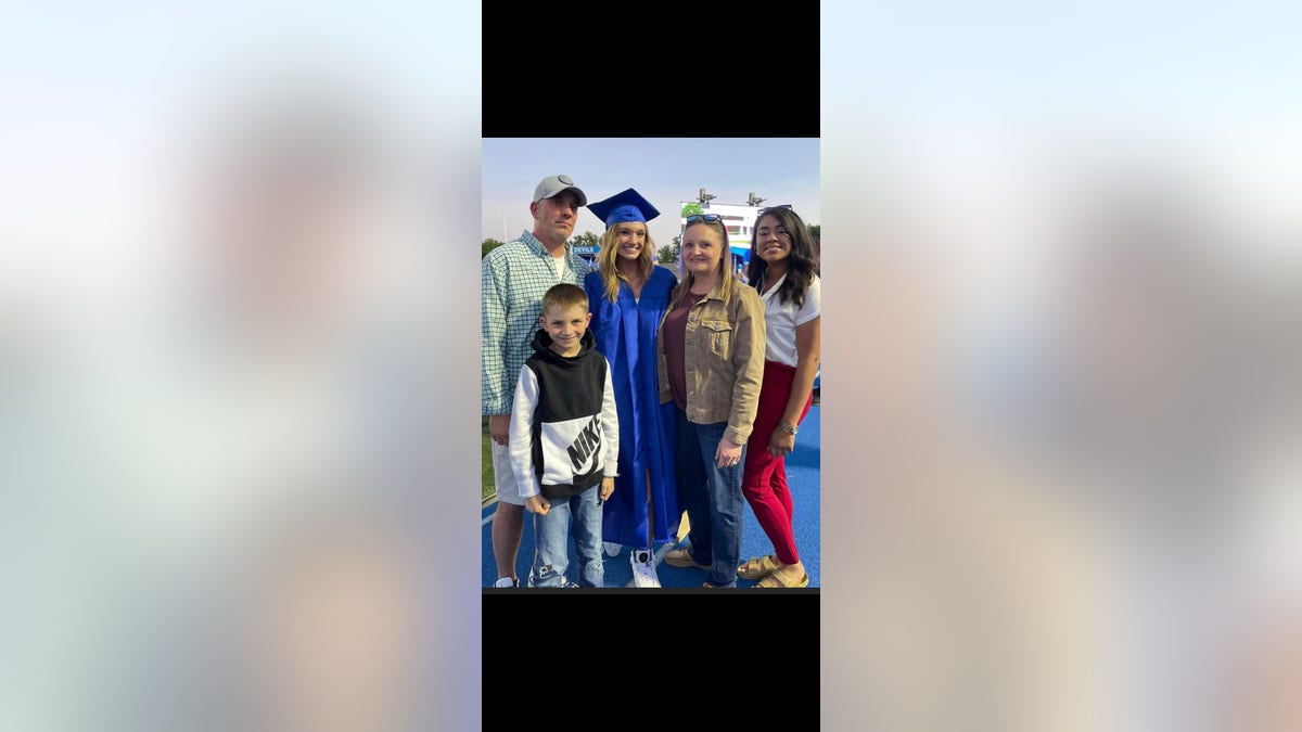 Cammy Vaughan during her high school graduation surrounded by Dad, Stepmom, Sister (Tyona), and Brother (Jaxson).